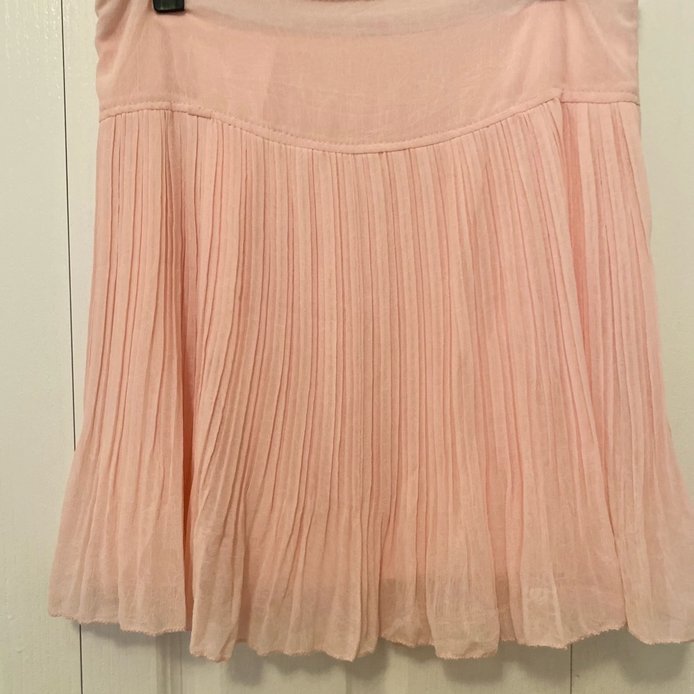 Mayuki blush colored pleated mini skirt. Size Large.
